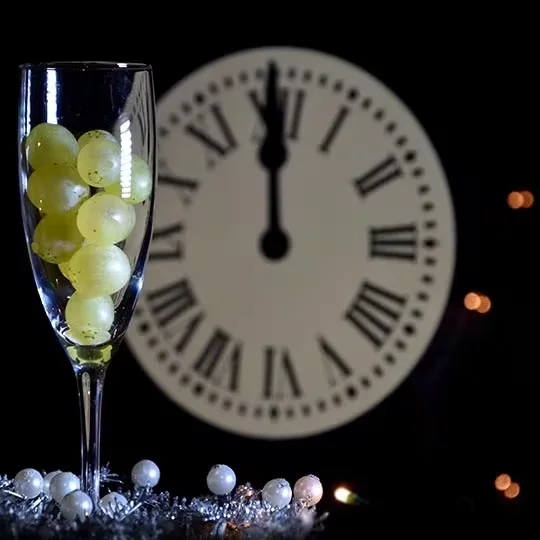 Image of grapes next to clock